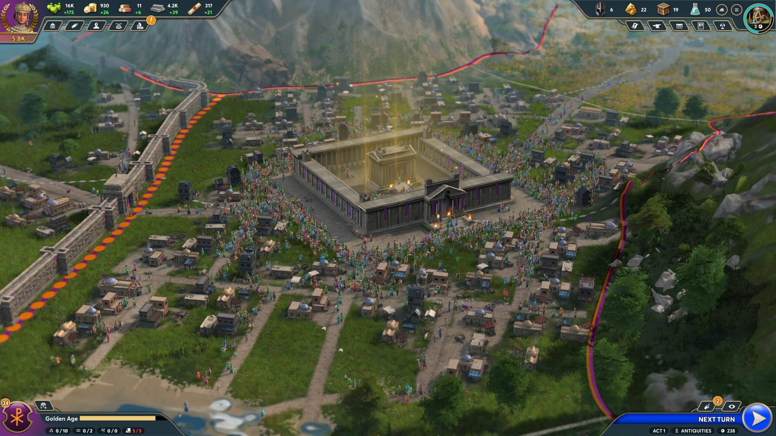 A crowd of people gather around a newly completed Triumph nestled in a lush valley.